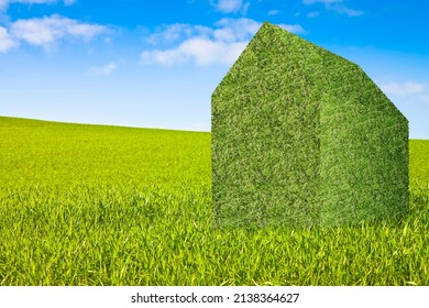 Land Plot Management - Real Estate Concept With A Vacant Land On A Green Field Available For Building Construction With A Green Home Icon - The Architecture Of The Future 