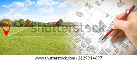 Land plot management - real estate concept with a vacant land on a green field available for building construction in a residential area against an imaginary cadastral map
