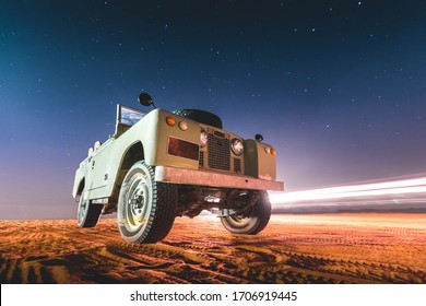 Land Rover And Starry Sky At Night In The Desert Of Dubai - UAE