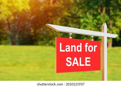 Land For Sale Sign. Red Sign For Sale Plot. Green Lawn Behind Sign. Land For Sale Signboard On Street Signs. Buying Plot Building A House. Signboard Of Realtor Or Real Estate Agent.