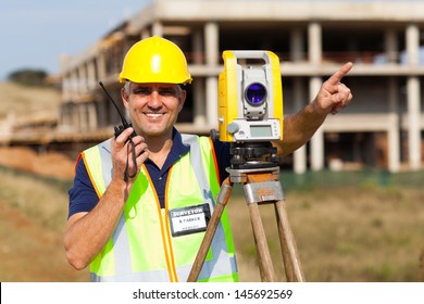 Land Surveyor Speaking On Walkie Talkie Stock Photo 145692569 ...