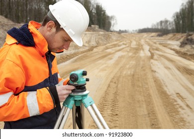 Land surveyor working on a construction site.
