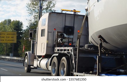 Land Transport Of Boats And Yachts. Truck With A Special Trailer For Boat Transport.