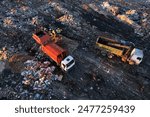 Landfill garbage truck. Garbage truck unloads rubbish in landfill. Landfill waste disposal. Garbage dump, waste plastic. Reduce greenhouse, methane emissions. Mustard gas among toxic waste in landfill