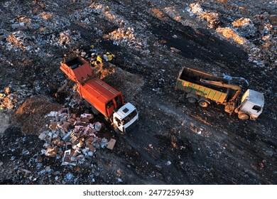 Landfill garbage truck. Garbage truck unloads rubbish in landfill. Landfill waste disposal. Garbage dump, waste plastic. Reduce greenhouse, methane emissions. Mustard gas among toxic waste in landfill - Powered by Shutterstock