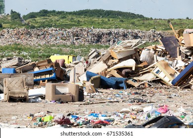 Landfill. Old Furniture At The Garbage Dump.