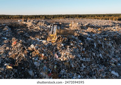 Landfill with rubbish, drone view. Landfill waste disposal. Garbage dump, waste plastic. Reduce greenhouse, methane emissions. Mustard gas among toxic waste in landfill. Dozer on Garbage dump. - Powered by Shutterstock