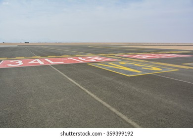  Landing Light Directional Sign Markings On The Tarmac Of Runway At A Commercial Airport