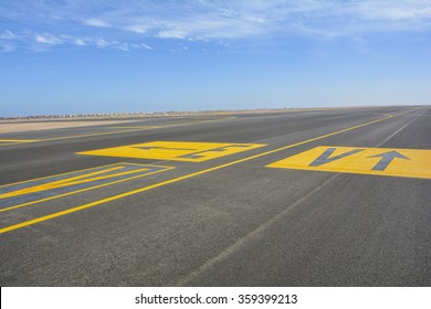  Landing Light Directional Sign Markings On The Tarmac Of Runway At A Commercial Airport