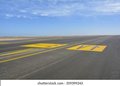  Landing Light Directional Sign Markings On The Tarmac Of Runway At A Commercial Airport