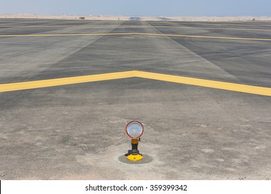  Landing Light Directional Sign Markings On The Tarmac Of Runway At A Commercial Airport