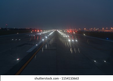 Landing Lights ON A Airport Runway At NighT Sky.
