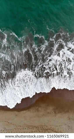 Similar – Aerial Panoramic Drone View Of Blue Ocean Waves Crushing On Sandy Beach in Portugal