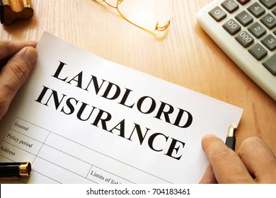 Landlord Insurance On A Desk.