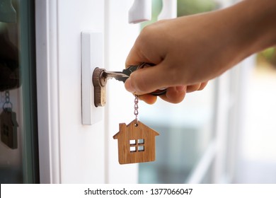 Landlord unlocks the house key for new home   