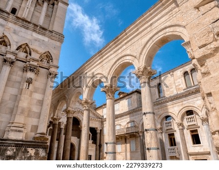The landmark ancient Roman columns and arches of the central courtyard, called the Peristyle, in Diocletian's Palace, located in the Old Town of Split, Croatia