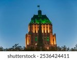 the landmark finance ministry building illuminated at night in Quebec Canada.