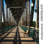 The Landmark Meridian Bridge with Bench across the Missouri River in Yankton: The double-deck bridge, opened in 1924, connecting Nebraska and South Dakota