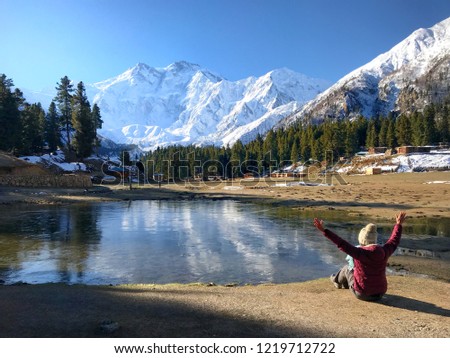 The landmark of Pakistan. Women sit enjoy beauty peak of