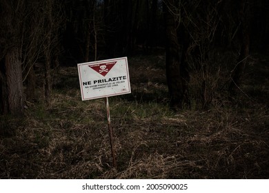Landmines Danger sign Near Osijek Croatia 02.04.2021. (Sign translation from Croatian: Turn back! Beyond this point there is a high risk of a landmine encounter)