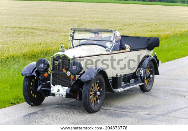 LANDSBERG, GERMANY - JULY 12, 2014: Public oldtimer\
rally organized by Bavarian city Landsberg for at least 80 years\
old veteran cars with unknown drivers in Buick Master Six, built at\
year 1926