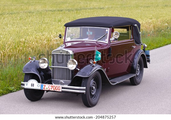 LANDSBERG, GERMANY - JULY 12, 2014: Public oldtimer
rally organized by Bavarian city Landsberg for at least 80 years
old veteran cars with unknown drivers in Wanderer W10
GlÃ?Â?Ã?Â¤ser, built at year
1930