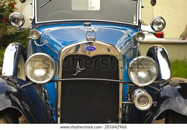 LANDSBERG, GERMANY\
- JULY 12, 2014: Public oldtimer rally in Bavarian city Landsberg\
for at least 80 years old veteran cars with a front view of Ford A\
de Luxe, built at year\
1930