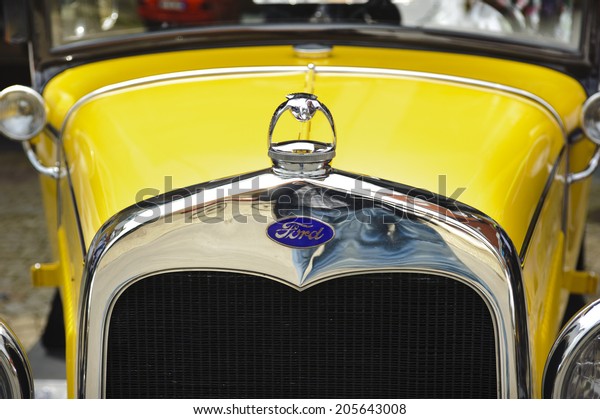 LANDSBERG, GERMANY -\
JULY 12, 2014: Public oldtimer rally in Bavarian city Landsberg for\
at least 80 years old veteran cars with a front view of Ford A\
Coupe, built at year\
1930