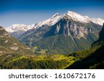 Landscape of the Alps. Snow-capped mountain peaks. beautiful meadows of Austria. Freedom, tourism, travel