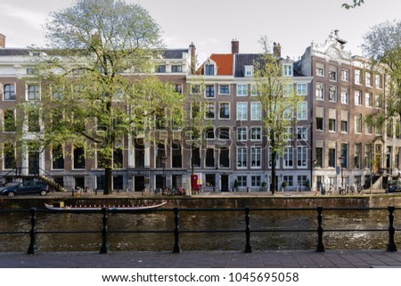 Similar – Schöne Architektur niederländischer Häuser und Hausboote am Amsterdamer Kanal im Herbst