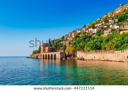 Landscape of ancient shipyard near of Kizil Kule tower in Alanya peninsula, Antalya district, Turkey, Asia. Famous tourist destination with high mountains. Part of ancient old Castle. Summer day