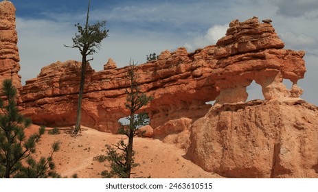 A landscape of an arched rock formation in Bryce Canyon, Utah - Powered by Shutterstock