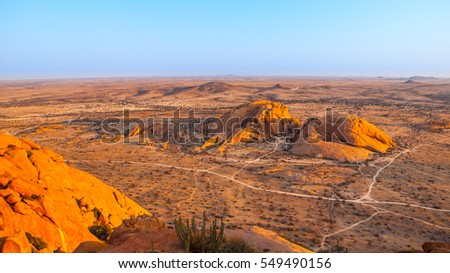 Landscape around Spitzkoppe, aka Spitzkop, with massive granite rock formations, Namib Desert in Namibia, Africa.