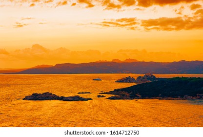 Landscape at Baja Sardinia luxury resort, Costa Smeralda at sunset and evening, Sardegna island in Italy in summer. Scenery in Olbia province. Sunset at Mediteranean sea. Mixed media.