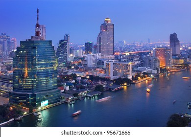 Landscape of Bangkok skyline. The capital of Thailand, one of the colourful cities in Asia. Along the river have  hight building. State tower is famous for dinner and nice panoramic of Bangkok night.