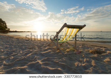 Landscape of Beach chair and beautiful sunrise in the morning.