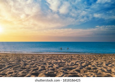 landscape of beach at sunset with dramatic cloudy sky