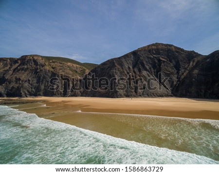 Similar – Aerial Drone View Of Blue Ocean Waves And Beautiful Sandy Beach Shore in Portugal