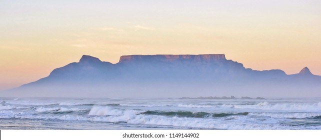 Landscape with beach and Table mountain at sunrise

