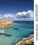 landscape of beach under clouds