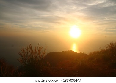 Landscape of beautiful sunset down to the sea seeing on the hill with clouds views at Black Rock View Point, Phuket, Thailand