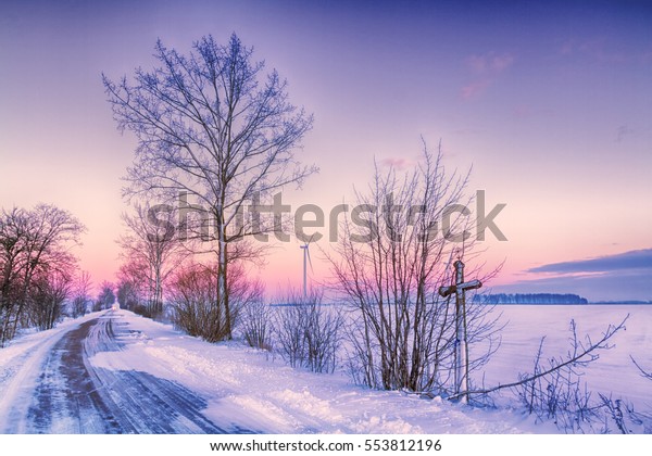 Landscape - Beautiful\
winter morning or afternoon. Polish winter road between fields with\
snow and good\
weather.