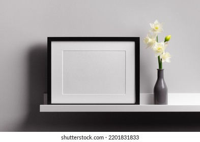 Landscape Black Picture Frame Mockup On Shelf With Flowers