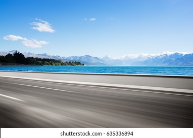 Landscape Of Blue Sea From Empty Road