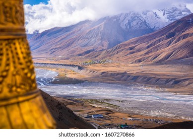 Landscape of braided Spiti river valley and snow capped mountains during sunrise from Key or Kee monastery near Kaza town in Lahaul and Spiti district of Himachal Pradesh, India. 