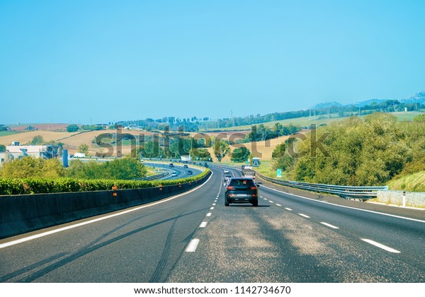 Landscape with Cars on the\
road in Italy