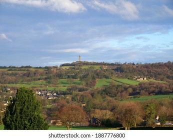 Landscape With Castle Hill Monument Protruding On The Skyline Blue Sky Green Fields Trees And Buildings On Hillside And Valley Huddersfield Yorkshire England 05-01-2021 By Roy Hinchliffe