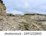 Landscape with chalk rocks in the steppes of Kazakhstan. Late Cretaceous. Landscape with clouds.