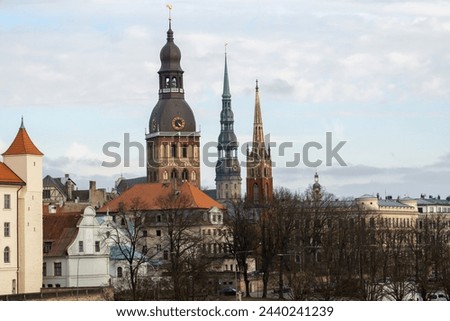 The landscape of the city. Old Town. Riga. A view of church towers in an unusual pivot. Riga Dom, Peterchurch and Anglican Church.
