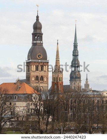 The landscape of the city. Old Town. Riga. A view of church towers in an unusual pivot. Thought Church, Peterchurch and Anglican Church.